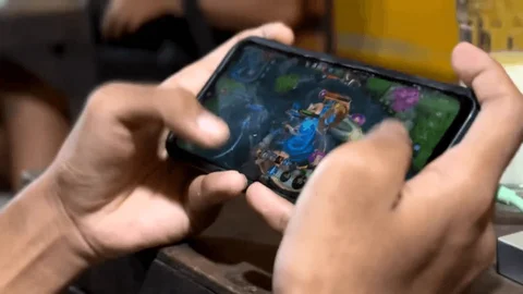 Mobile gaming demonstration shown on a smartphone screen during a technology showcase